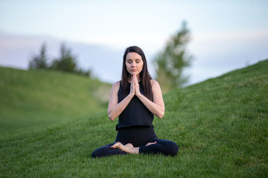 Girl Meditating to achieve inner balance